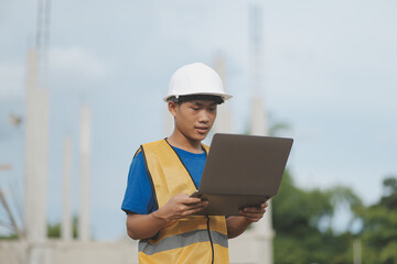 worker or engineer holding laptop computer and checking inside containers warehouse storage