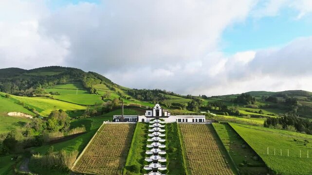 Aerial fly Ermida de Nossa Senhora da Paz famous chapel at Azores Portugal green landscape