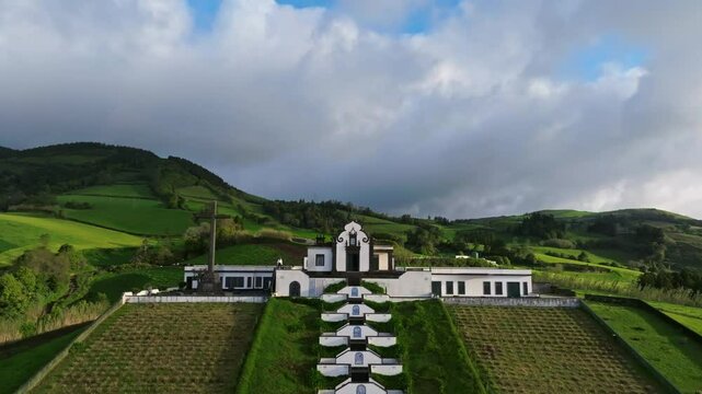 Aerial reveals green wide hills landscape at Ermida de Nossa Senhora da Paz tour in Portuguese travel destination