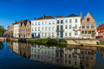 View of Bruges canal and old historic houses of medieval architecture. Brugge, Belgium