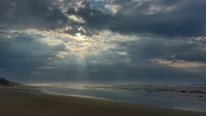 Stormy sky over the  Sea. The sun's rays make their way through the clouds.