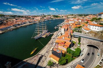 Aerial view of Porto city and Vila Nova de Gaia and Douro river with moored sailling ship from Dom Luis bridge I. Porto, Portugal