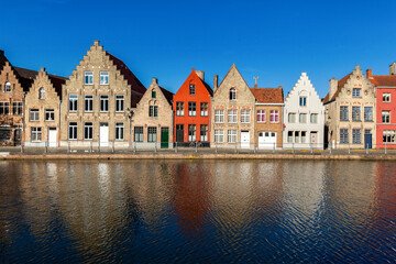Naklejka premium Typical European Europe cityscape view - canal and medieval houses. Bruges (Brugge), Belgium