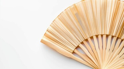 Top view of bamboo fan on white background with copy space