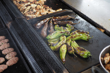  long green pepper being barbecued at a grill