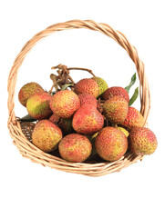 A basket of summer fruit lychees on a white background