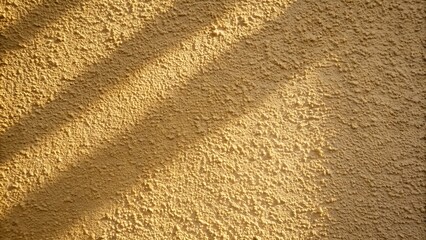 Textured wall with light and shadow.