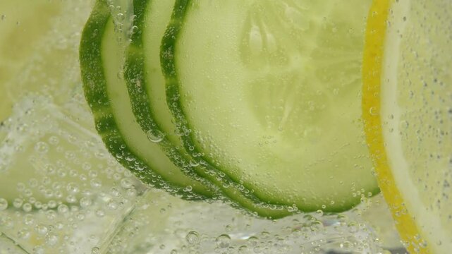 Cucumber lemonade in an ice glass. A refreshing drink with lemon and cucumber slices that energizes and quenches thirst