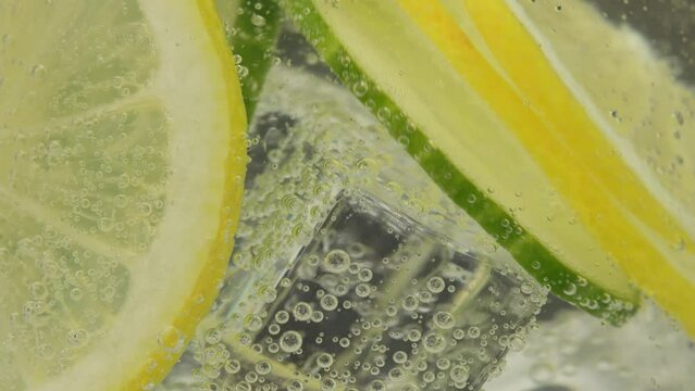 Cucumber lemonade in an ice glass. A refreshing drink with lemon and cucumber slices that energizes and quenches thirst