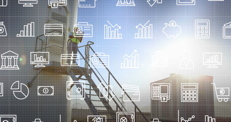 Image of falling icons over windmill