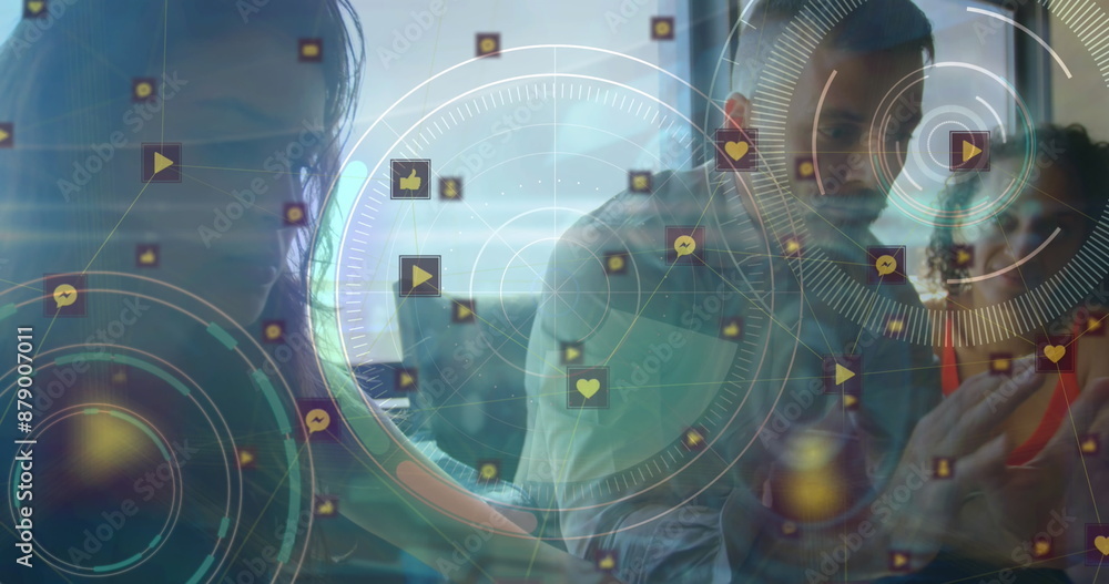 Poster image of circles with social media and computer icons over colleagues discussing in office