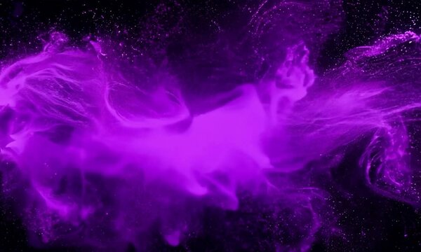 Purple powder explosion creating a vibrant and dynamic abstract pattern. The purple color forms a unique dust cloud