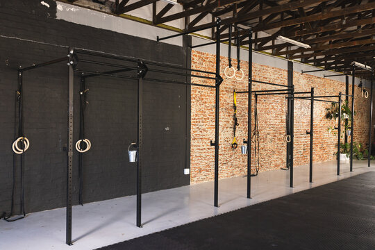 A well-equipped gym with various workout stations, with copy space