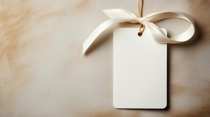 white blank tag with a rope for mockup on cream color background