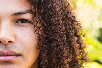 Close-up of a young biracial man outdoors, unaltered