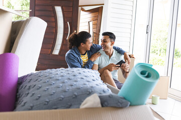 Gay biracial couple enjoys leisure time at home