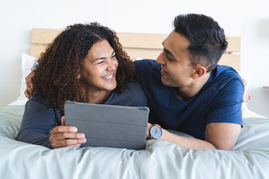 Gay biracial couple enjoys leisure time at home - Powered by Adobe