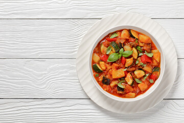 hearty italian vegetable stew in bowl, top view
