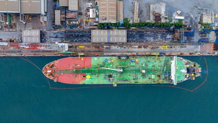 Oil tanker ship at dry dock concept maintenance service. working at dry dock. Insurance and...