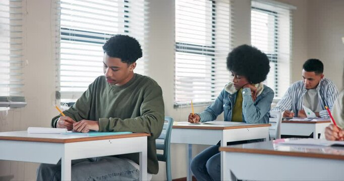 Exam, thinking and question with student in classroom of school for assessment, problem solving or university test. Answer, education and solution with teen boy in class for development or growth