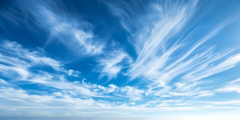 Tranquil Blue Sky with Wispy Clouds Forming Elegant Patterns in the Sun. Concept Cloud Photography, Sky Art, Nature Patterns, Tranquil Skies, Cloudscape Art