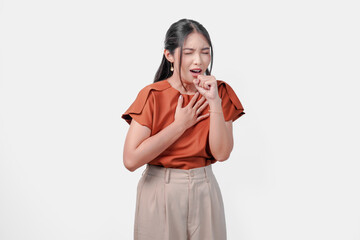 A sick Asian woman in brown shirt coughing and has a runny nose.