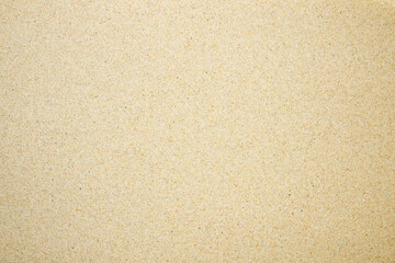 Sand on the beach as background, top view.