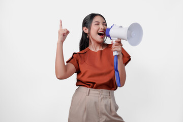 Energetic Asian woman showing number one with finger screaming loud using megaphone speaker.