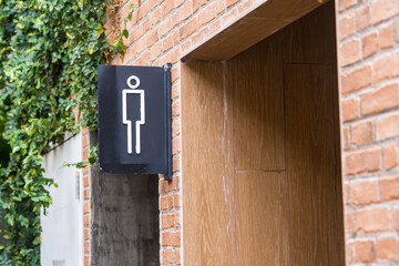 Men public toilet sign In the garden thailand.