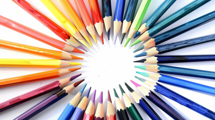 Colorful pencils arranged in a radial pattern on white background

