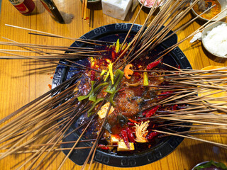 Chuanchuan hotpot is a delicacy in Chongqing. Various ingredients are skewered on bamboo skewers and then hot pot, which is affordable and of good quality, deeply loved by the people.