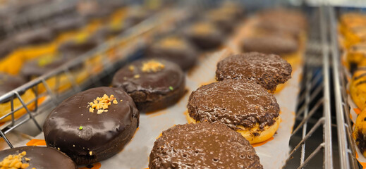 Delicious assortments of sugary donuts with different flavors and colorful topping good for backgrounds and multimedia content