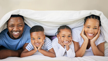 Black family, blanket and relax in home portrait, bonding and security in relationship or love. Parents, children and duvet for fort or care in bedroom, morning happiness and rest together on bed