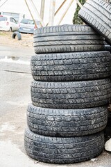 Stack of Used Tires on Pavement