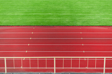 sport arena local place background running track red lines and green grass soccer field wallpaper...