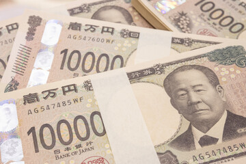 Close-up image of the new Japanese 10,000 yen note, grouped in a strip.