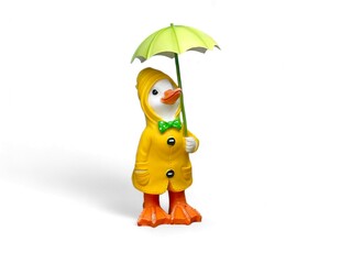 Miniature of duck wear raincoat and umbrella isolated on white 
