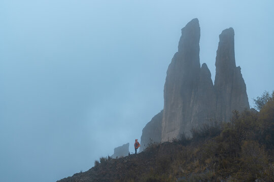person with a red rain cover in the las animas valley in Bolivia