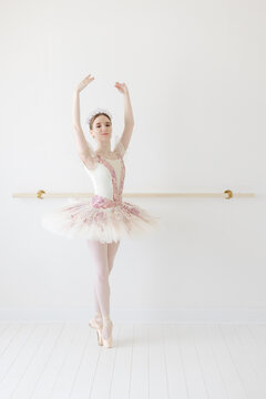 ballerina dances en pointe with arms in open 5th position