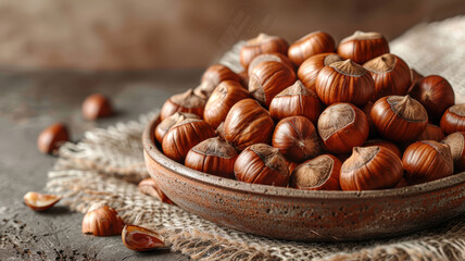 Obraz premium Roasted Chestnuts on Rustic Brown Background