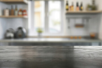 Empty tabletop surface with blurred kitchen background for product display