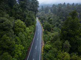Haast Pass, New Zealand: Aerial drone view of the pass road between Wanaka and Haast in New Zealand south island West coast famous for its wild landscape on a rainy day.