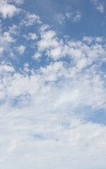 Blue sky and white puffy clouds.