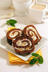 Chocolate Swiss roll with walnuts.