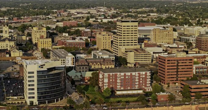 Evansville Indiana Aerial v6 zoomed tracking flyover along the river capturing waterfront town center with a mix of historic and modern buildings - Shot with Mavic 3 Pro Cine - September 2023
