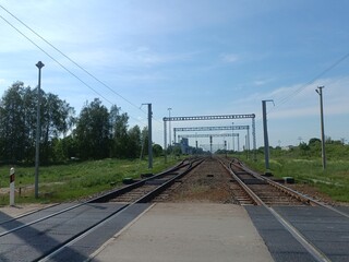 Two way railroad tracks in countryside. Two railway tracks. Sunny day. Countryside. Fields and...