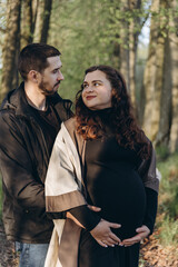Man and Woman Standing in Woods