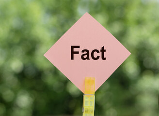 Pink Sign With the Word Fact