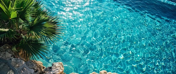 The pool edge and the sparkling water below from a high angle create a unique summer atmosphere and a feeling like a vacation.