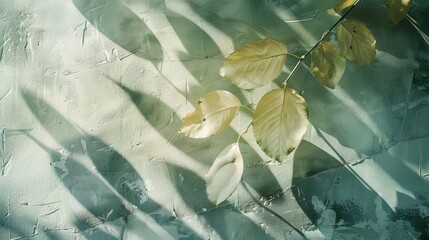 Sunlight filters through leaves, casting shadows on a textured surface, creating a serene autumn scene with yellow leaves